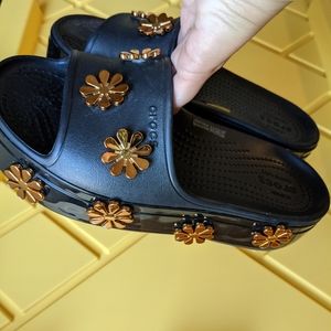 Black platform Crocs slides